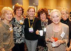 Photo of a group of women smiling. 